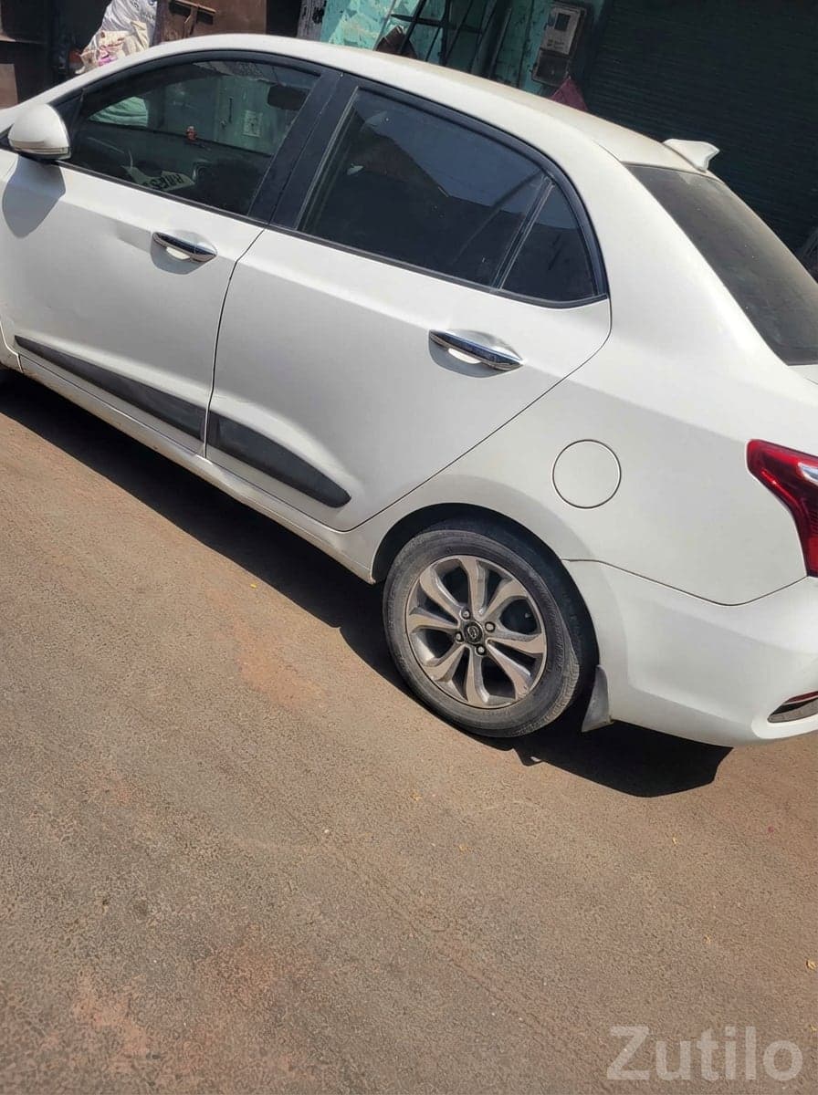 White Compact Sedan with Alloy Wheels