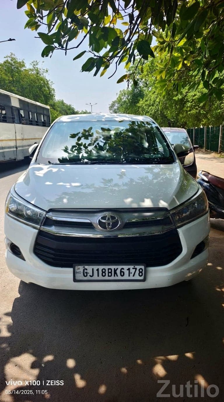 White Toyota Innova Crysta MPV