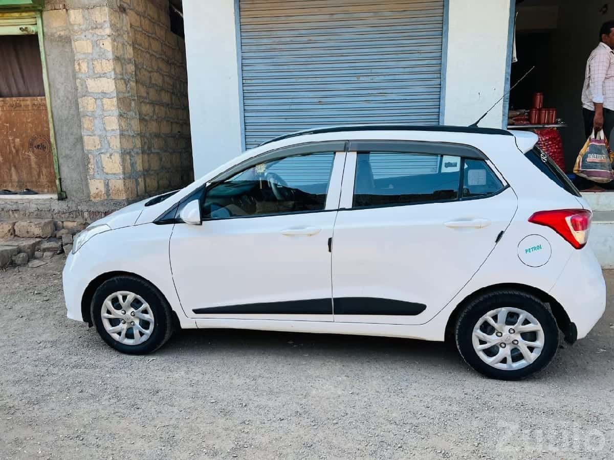 Hyundai Grand i10 white petrol car Hyundai Grand i10 white petrol car